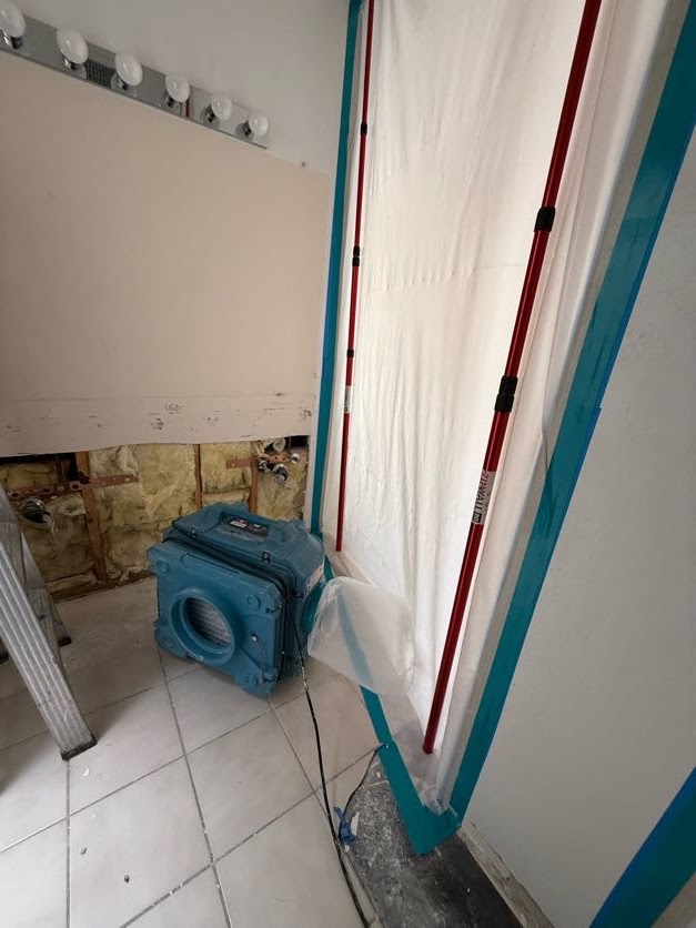 Artistic Restoration working inside a contained mold remediation area in Tucson